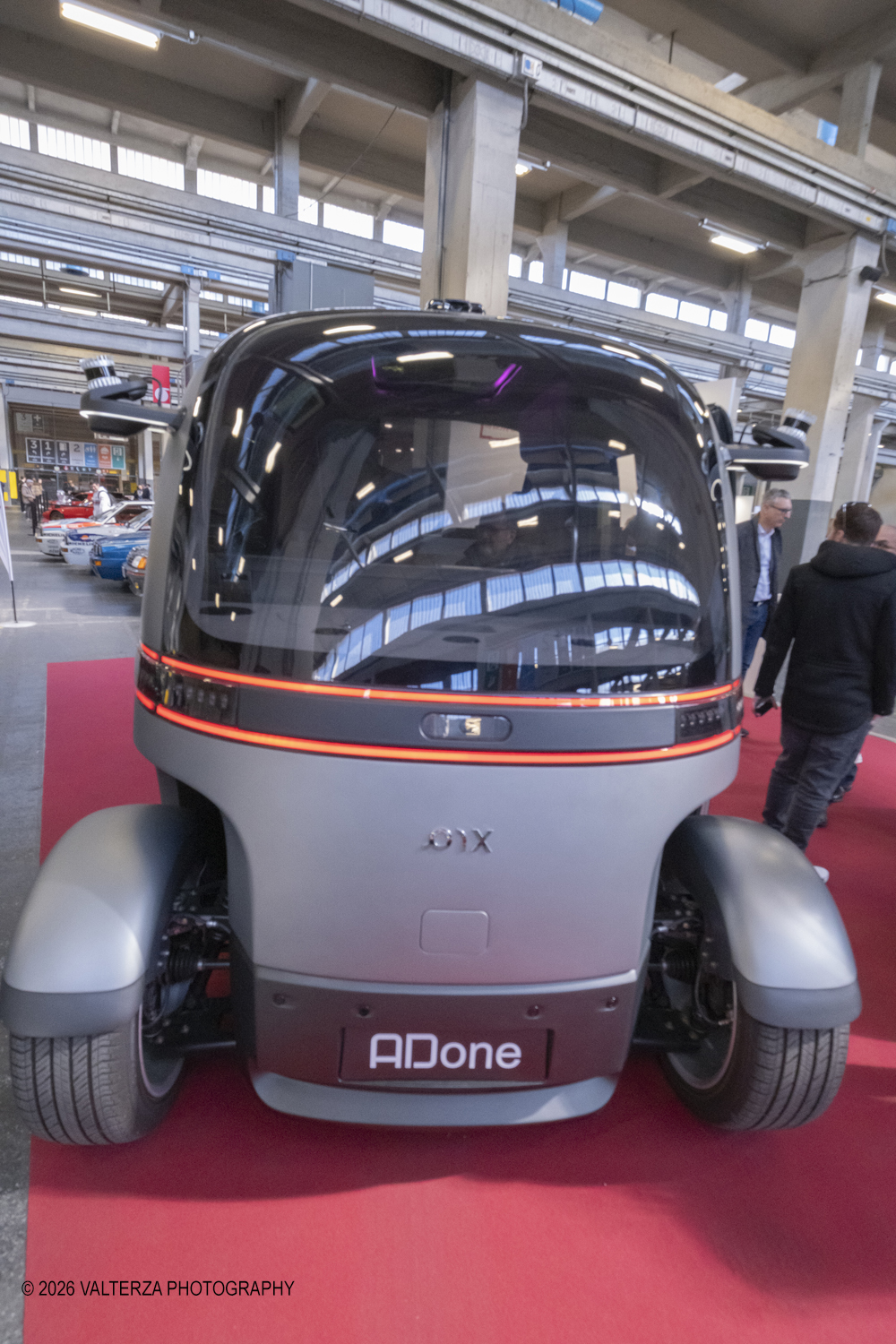_DSF6446.jpg - 27/03/2026/. Torino.  Ad AMTS , Auto Moto Turin Show, lo spettacolo Ã¨ protagonista per tutto il weekend! 3 arene indoor e 2 piste outdoor dedicate agli show. Spettacoli di freestyle, drifting e stunt con piloti e rider professionisti. Nella foto l'azienda Tecnocad ha presentato Adone, un robotaxi a guida autonoma pensato per il trasporto urbano.