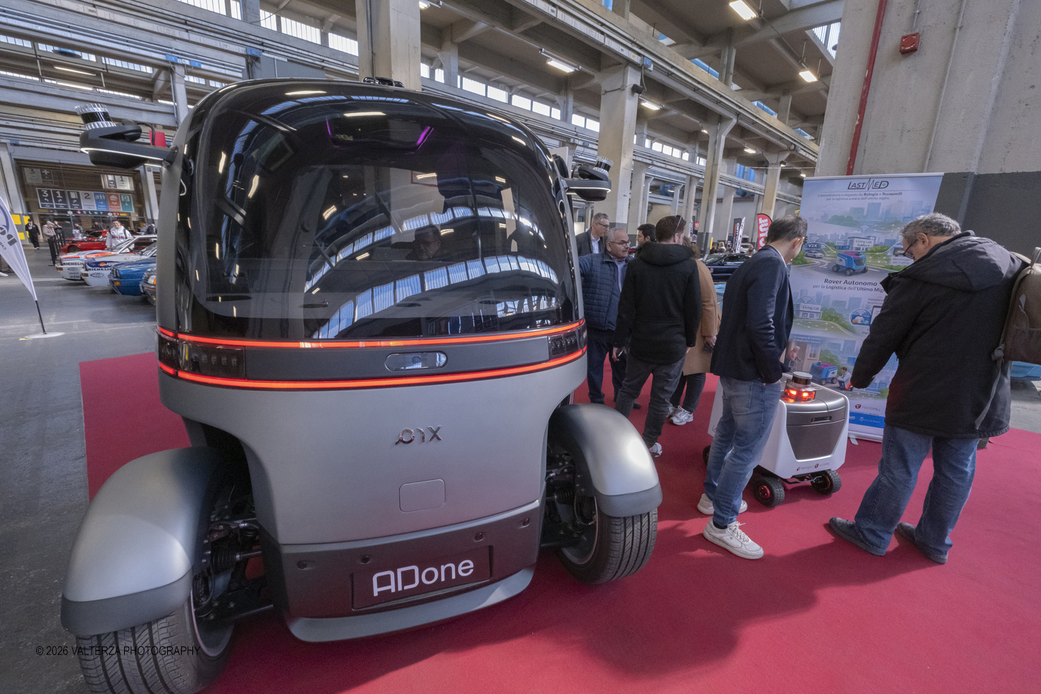 _DSF6448.jpg - 27/03/2026/. Torino.  Ad AMTS , Auto Moto Turin Show, lo spettacolo Ã¨ protagonista per tutto il weekend! 3 arene indoor e 2 piste outdoor dedicate agli show. Spettacoli di freestyle, drifting e stunt con piloti e rider professionisti. Nella foto l'azienda Tecnocad ha presentato Adone, un robotaxi a guida autonoma pensato per il trasporto urbano.