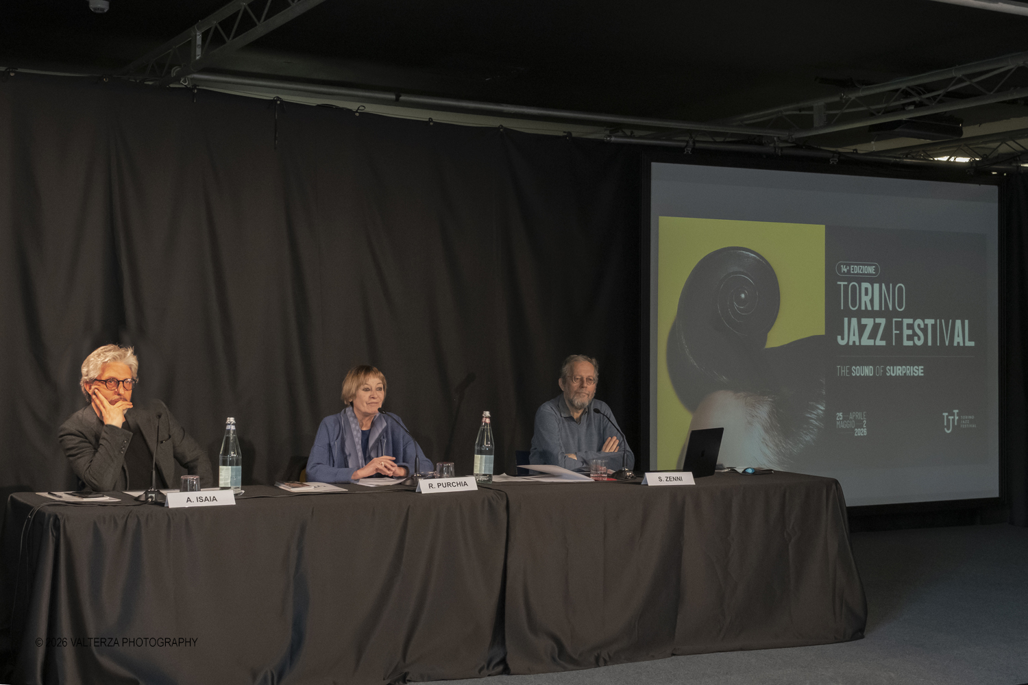 DSCF3698.jpg - 19/03/2026. Torino. Conferenza Stampa di presentazione. Il Torino Jazz Festival, con la direzione artistica di Stefano Zenni, torna da sabato 25aprile a sabato 2 maggio 2026..Al TJF XIV si esibiranno 297 musicisti nazionali e internazionali, dai talenti emergentai grandi protagonisti della scena mondiale. Nella foto il tavolo dei relatori con Alessandro Isaia, Rosanna Purchia e Stefano Zenni.