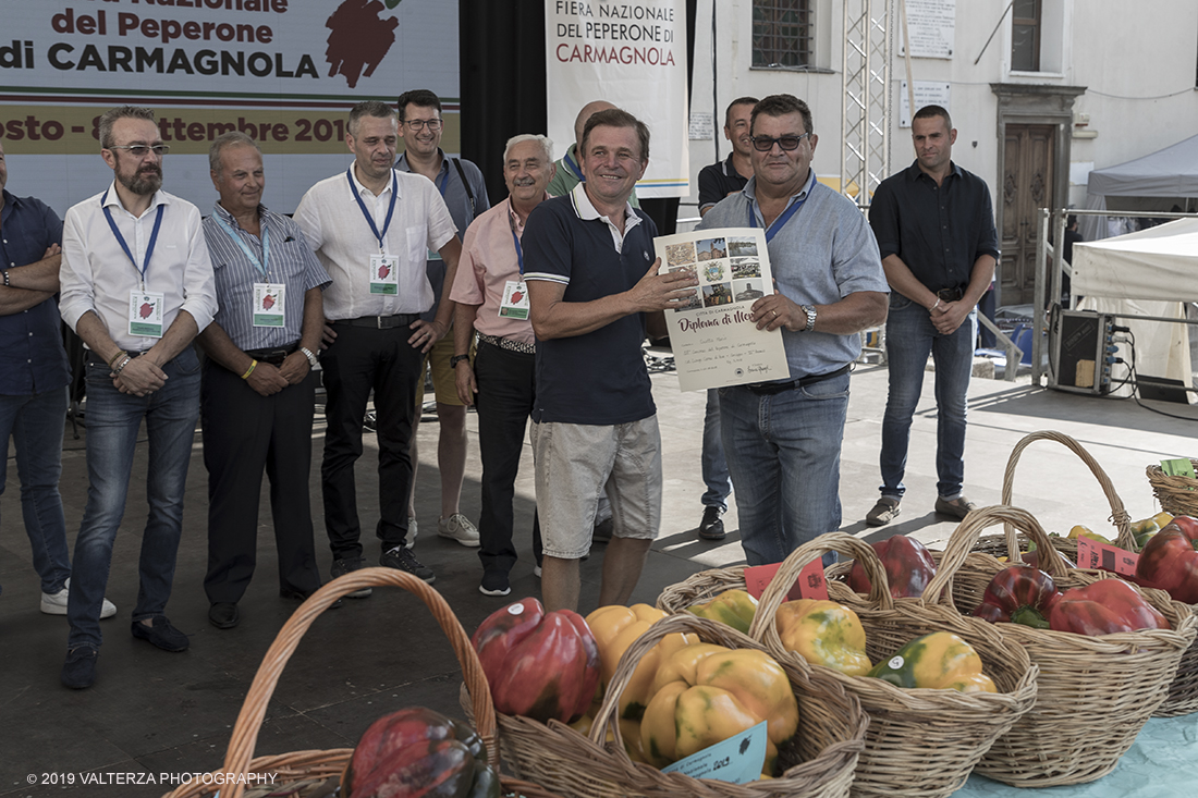 _G3I3646.jpg - 01/09/2019. Carmagnola. TO. Concorso del Peperone  Riservato ai produttori dellâ€™area di coltivazione del Peperone di Carmagnola, si premiano i migliori esemplari i dei quattro ecotipi locali: quadrato, lungo o corno di bue, trottola e tumaticot. Nella foto un momento della premiazione dei vincitori il concorso del Peperone