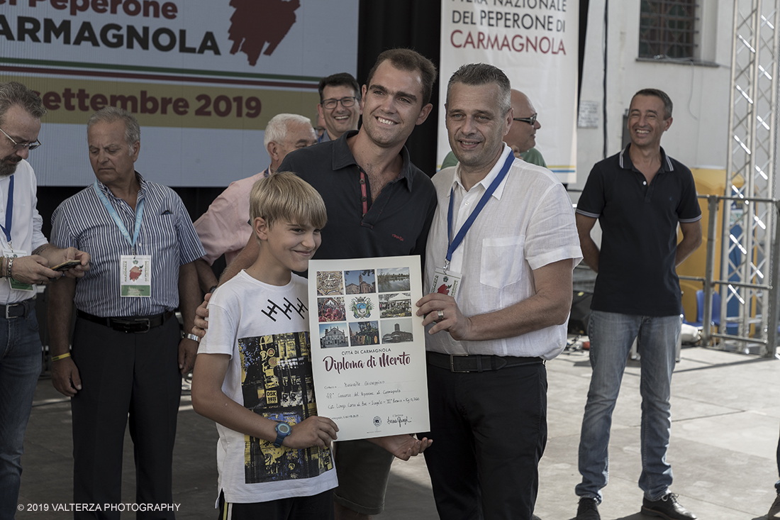 _G3I3659.jpg - 01/09/2019. Carmagnola. TO. Concorso del Peperone  Riservato ai produttori dellâ€™area di coltivazione del Peperone di Carmagnola, si premiano i migliori esemplari i dei quattro ecotipi locali: quadrato, lungo o corno di bue, trottola e tumaticot. Nella foto un momento della premiazione dei vincitori il concorso del Peperone