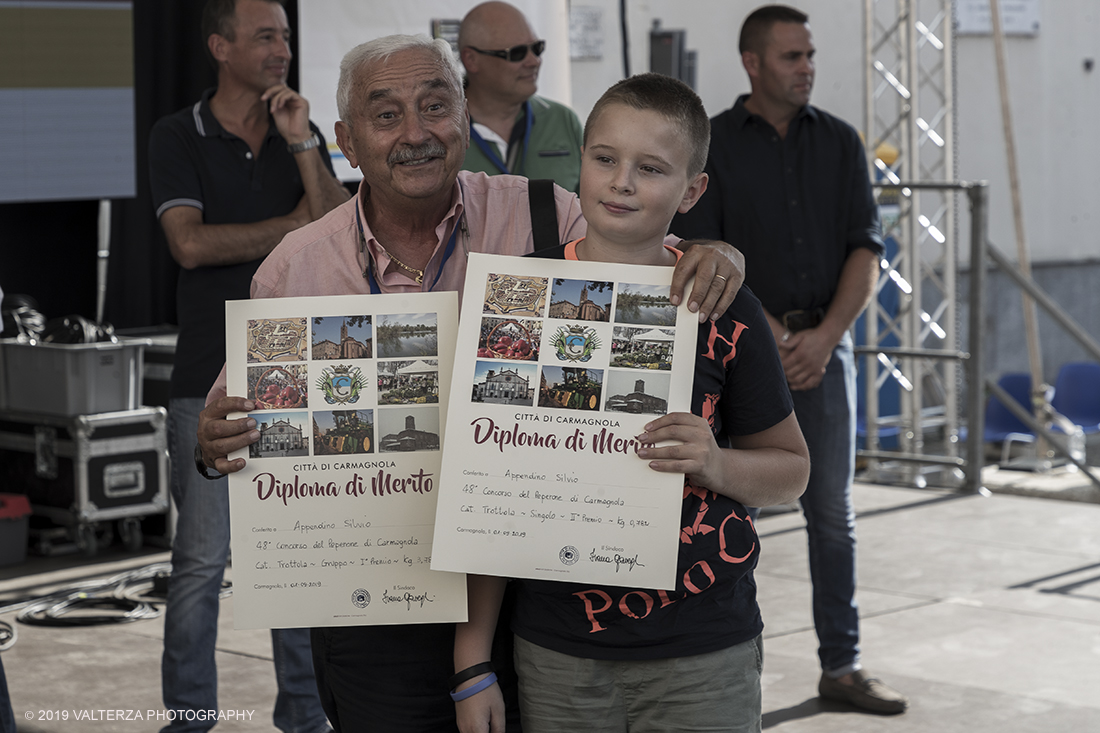 _G3I3702.jpg - 01/09/2019. Carmagnola. TO. Concorso del Peperone  Riservato ai produttori dellâ€™area di coltivazione del Peperone di Carmagnola, si premiano i migliori esemplari i dei quattro ecotipi locali: quadrato, lungo o corno di bue, trottola e tumaticot. Nella foto un momento della premiazione dei vincitori il concorso del Peperone