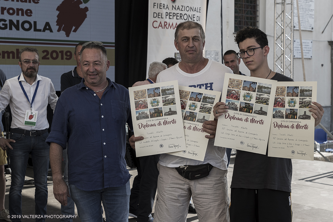 _G3I3751.jpg - 01/09/2019. Carmagnola. TO. Concorso del Peperone  Riservato ai produttori dellâ€™area di coltivazione del Peperone di Carmagnola, si premiano i migliori esemplari i dei quattro ecotipi locali: quadrato, lungo o corno di bue, trottola e tumaticot. Nella foto un momento della premiazione dei vincitori il concorso del Peperone