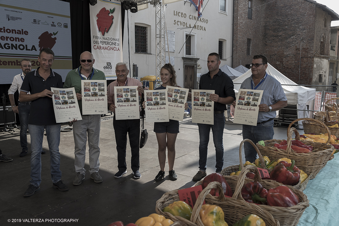 _G3I3778.jpg - 01/09/2019. Carmagnola. TO. Concorso del Peperone  Riservato ai produttori dellâ€™area di coltivazione del Peperone di Carmagnola, si premiano i migliori esemplari i dei quattro ecotipi locali: quadrato, lungo o corno di bue, trottola e tumaticot. Nella foto un momento della premiazione dei vincitori il concorso del Peperone