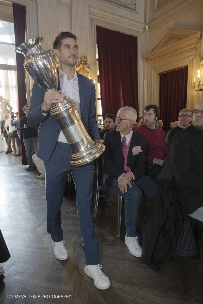 _DSF5474.jpg - Turin, Italy, February 5, 2025: A representative of Napoli Basket with the cup won last year take part in the press conference to present the FRECCIAROSSA FINAL EIGHT 2025 basketball cup