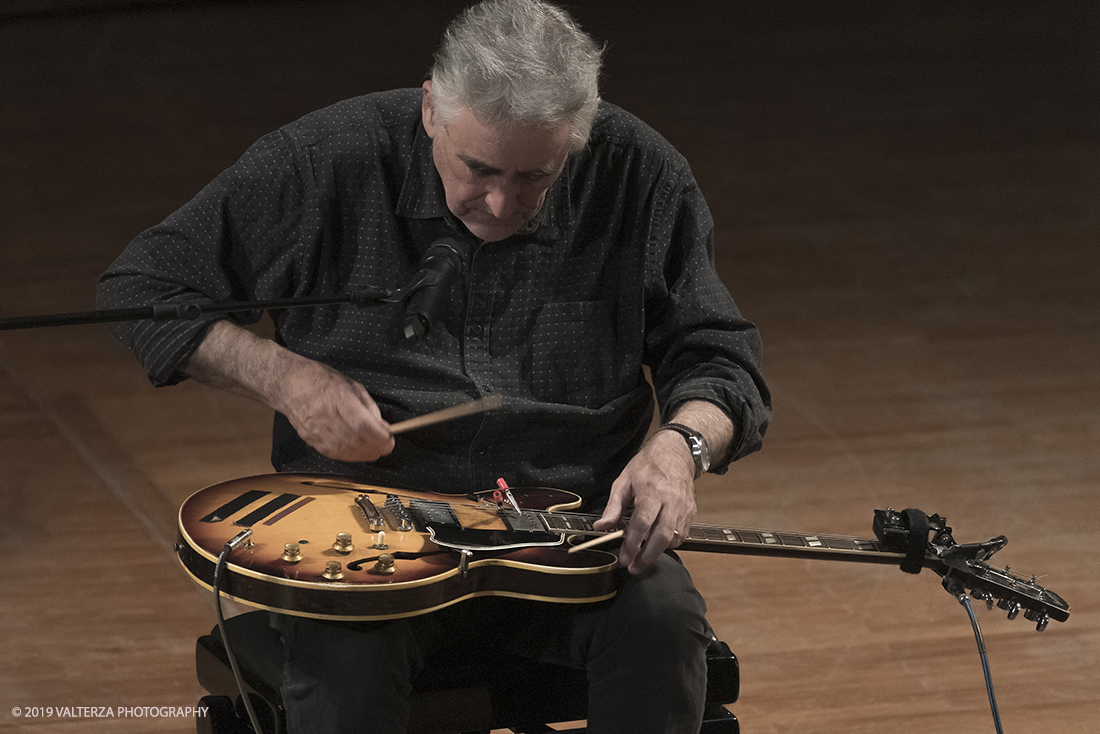 _G3I3023.jpg - 28/04/2019.Torino,.Attivo da oltre cinquantâ€™anni nei piuÌ€ disparati contesti musicali, Fred Frith eÌ€ un vero pioniere della chitarra elettrica, fin dai tempi di gruppi avant rock come Henry Cow o Massacre (con Bill Laswell). Come improvvisatore radicale ha suonato con figure del calibro di Robert Wyatt o John Zorn e come compositore ha visto suoi lavori interpretati da affermati ensemble di musica contemporanea. Nella foto Fred Frith nella esibizione "solo electric guitar" sul palco del conservatorio Giuseppe Verdi.