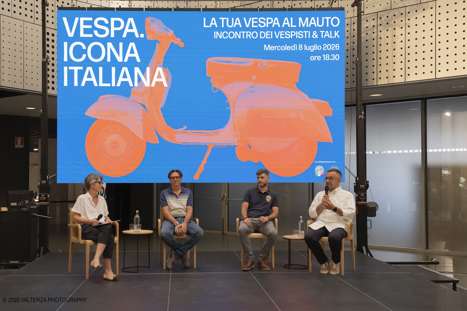 _DSF6290.jpg - 08/07/2026. Torino. In occasione della mostra VESPA. ICONA ITALIANA, il Museo Nazionale dellâ€™Automobile accoglie tutti i vespisti a vivere unâ€™esperienza esclusiva: per una sera la Piazza coperta del MAUTO ospita le Vespa dei partecipanti, che avranno lâ€™opportunitÃ  unica di esporre il proprio mezzo allâ€™interno del Museo, diventando protagonisti delle celebrazioni dedicate agli 80 anni di unâ€™autentica icona del design e della mobilitÃ  italiana. Nella foto un momento del Talk con Rino Drogo Curatore della mostra, Roberto Donati direttore storico culturale del Vespa Club dâ€™Italia, Marco Fumagalli collezionista titolare del materiale in mostra e imprenditore, Lorenza Bravetta Direttrice del MAUTO