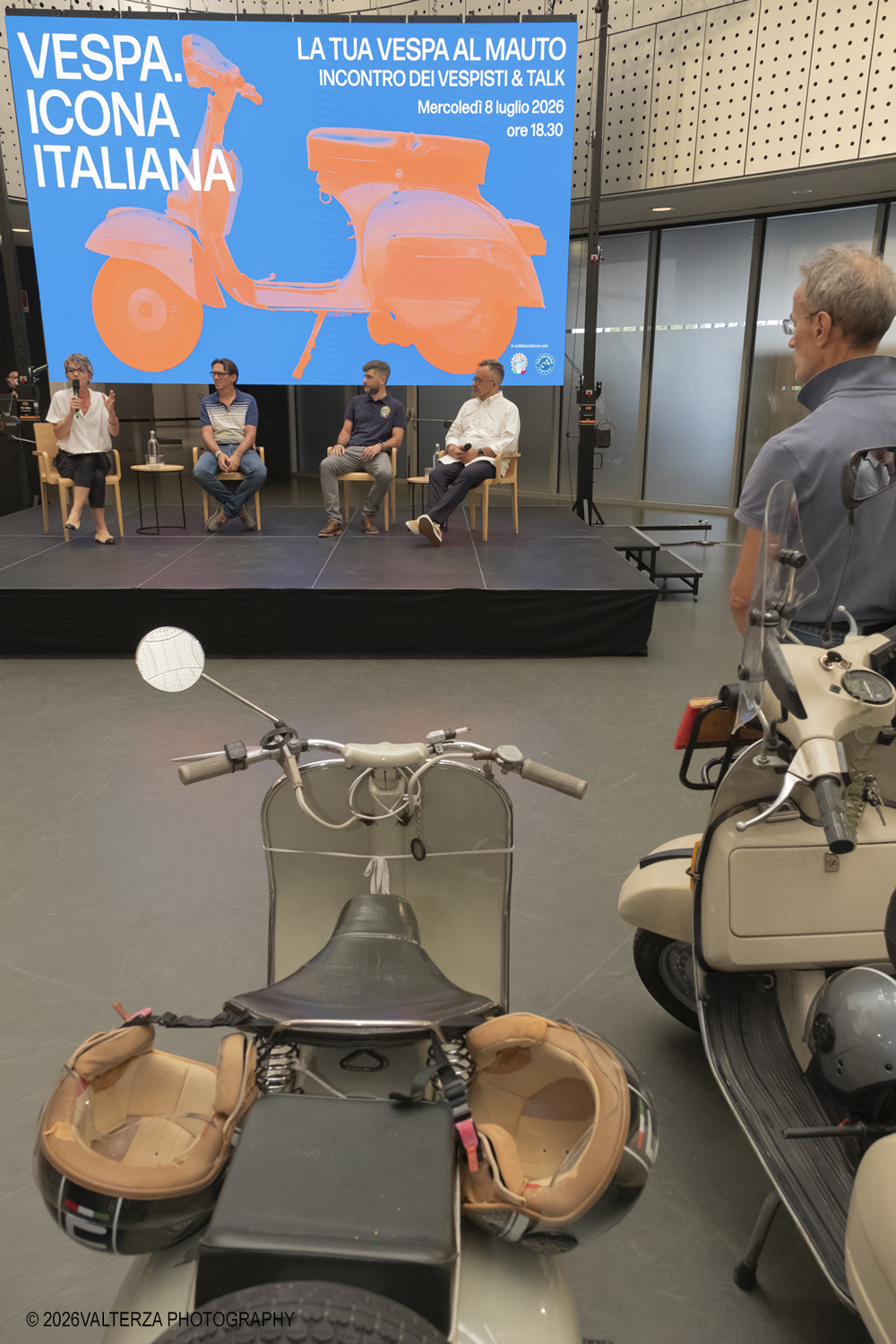 _DSF6294.jpg - 08/07/2026. Torino. In occasione della mostra VESPA. ICONA ITALIANA, il Museo Nazionale dellâ€™Automobile accoglie tutti i vespisti a vivere unâ€™esperienza esclusiva: per una sera la Piazza coperta del MAUTO ospita le Vespa dei partecipanti, che avranno lâ€™opportunitÃ  unica di esporre il proprio mezzo allâ€™interno del Museo, diventando protagonisti delle celebrazioni dedicate agli 80 anni di unâ€™autentica icona del design e della mobilitÃ  italiana. Nella foto 08/07/2026. Torino. In occasione della mostra VESPA. ICONA ITALIANA, il Museo Nazionale dellâ€™Automobile accoglie tutti i vespisti a vivere unâ€™esperienza esclusiva: per una sera la Piazza coperta del MAUTO ospita le Vespa dei partecipanti, che avranno lâ€™opportunitÃ  unica di esporre il proprio mezzo allâ€™interno del Museo, diventando protagonisti delle celebrazioni dedicate agli 80 anni di unâ€™autentica icona del design e della mobilitÃ  italiana. Nella foto un momento del Talk con Rino Drogo Curatore della mostra, Roberto Donati direttore storico culturale del Vespa Club dâ€™Italia, Marco Fumagalli collezionista titolare del materiale in mostra e imprenditore, Lorenza Bravetta Direttrice del MAUTO