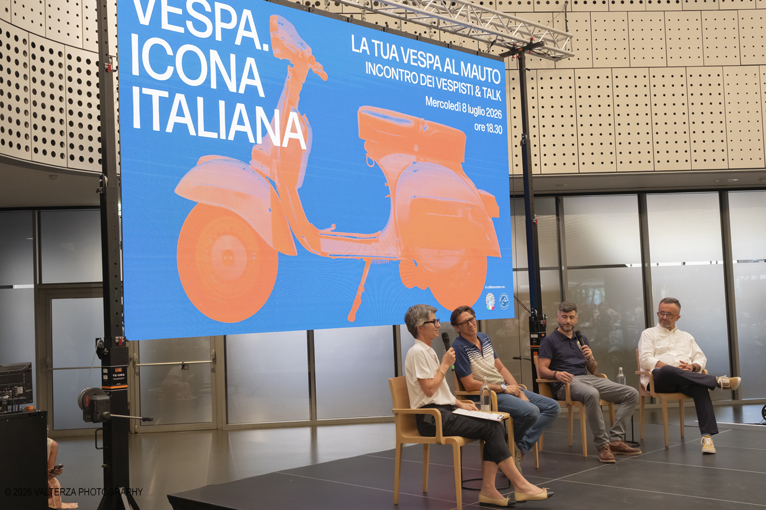 _DSF6305.jpg - 08/07/2026. Torino. In occasione della mostra VESPA. ICONA ITALIANA, il Museo Nazionale dellâ€™Automobile accoglie tutti i vespisti a vivere unâ€™esperienza esclusiva: per una sera la Piazza coperta del MAUTO ospita le Vespa dei partecipanti, che avranno lâ€™opportunitÃ  unica di esporre il proprio mezzo allâ€™interno del Museo, diventando protagonisti delle celebrazioni dedicate agli 80 anni di unâ€™autentica icona del design e della mobilitÃ  italiana. Nella foto un momento del Talk con Rino Drogo Curatore della mostra, Roberto Donati direttore storico culturale del Vespa Club dâ€™Italia, Marco Fumagalli collezionista titolare del materiale in mostra e imprenditore, Lorenza Bravetta Direttrice del MAUTO