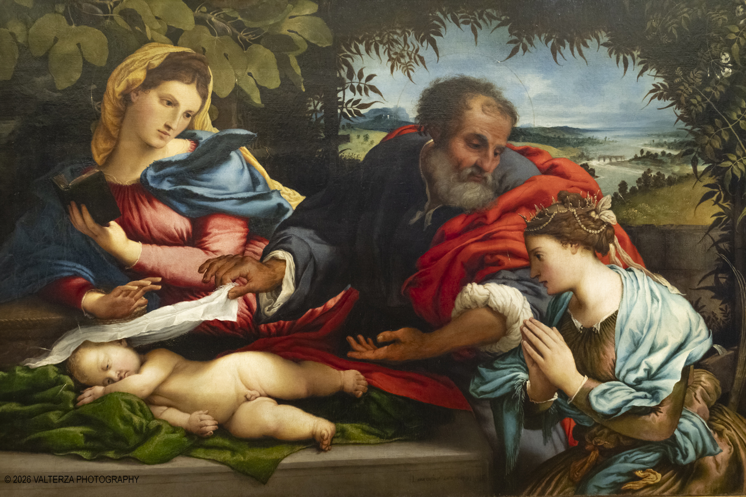 _DSF3919.jpg - 29/05/2026. Torino. Ai Musei Reali di Torino un confronto tra Lorenzo Lotto e Giovanni Girolamo Savoldo indaga le origini della â€œluce del veroâ€� che anticipÃ² la rivoluzione caravaggesca. In mostra tre dipinti del primo Cinquecento, disegni di Cavalcaselle e una â€œlezione immaginataâ€� di Roberto Longhi.  Nella foto  Lorenzo Lotto, Sacra famiglia con Santa Caterina dâ€™Alessandria (1533)
