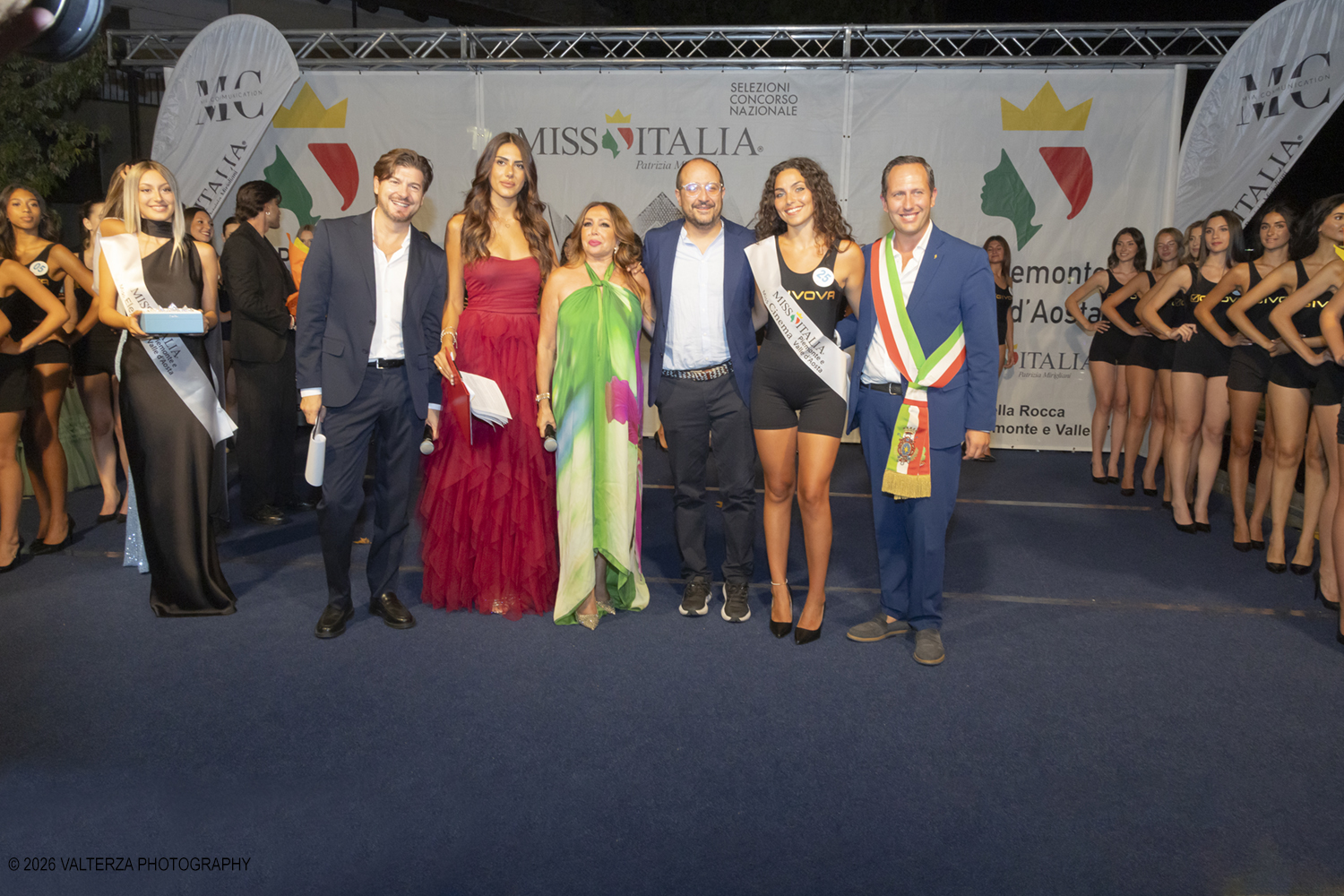 _Z3A7172.jpg - 08/08/2026. Giaveno . Finale Regionale di Miss Cinema Piemonte e Valle d'Aosta nonchÃ© lâ€™elezione di Miss sport Givova e Miss Giaveno che ha visto trionfare rispettivamente Carlotta Anguilano, Nicole Medini, e Martina Viglierco. Nella foto la nomina della nuova Miss Cinema Carlotta Anguilano con con la esclusivista regionale Mirella Rocca  i presentatori  Francesca Spinelli ed  Andrea Beltramo ed il sindaco Stefano Olocco