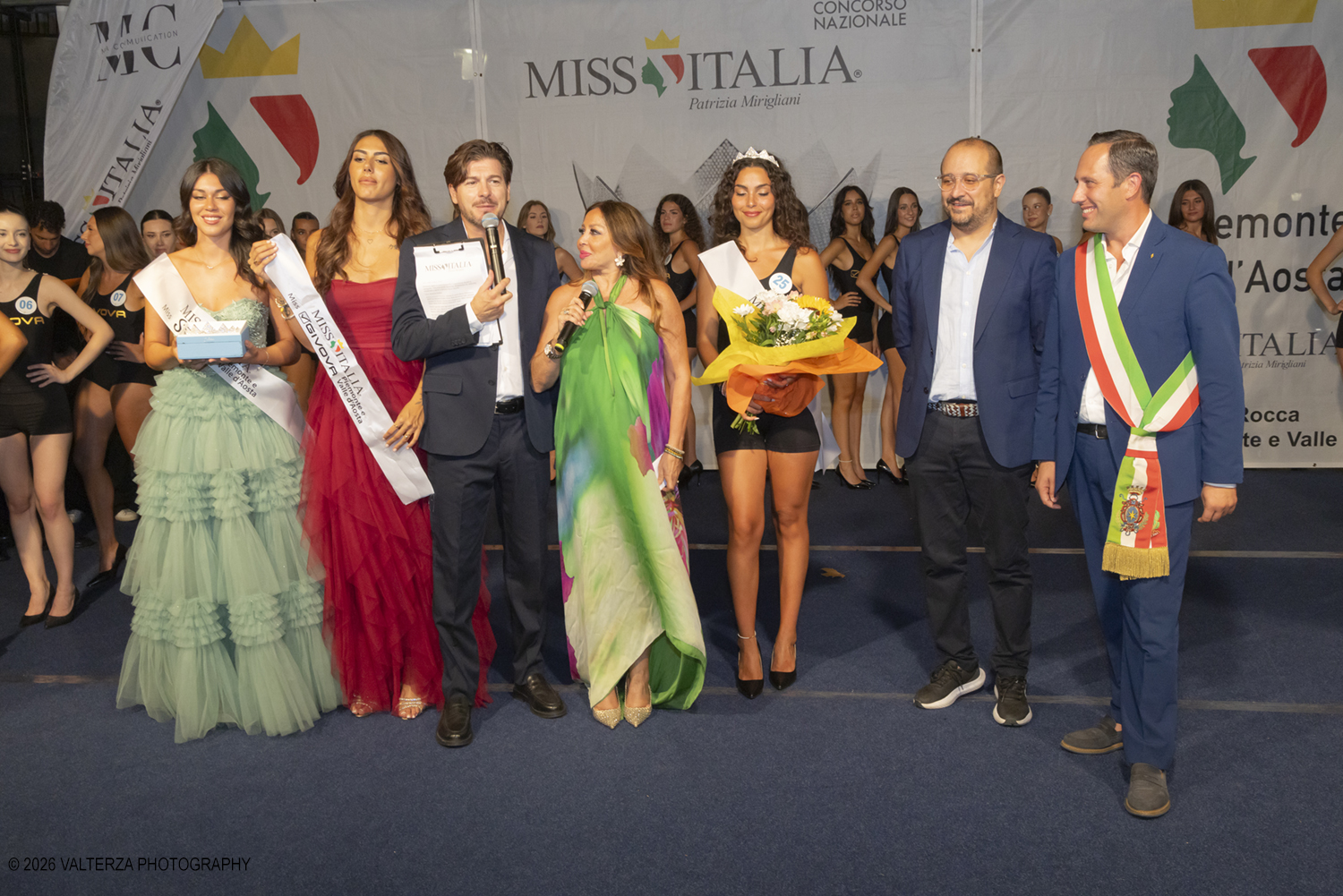 _Z3A7217.jpg - 08/08/2026. Giaveno . Finale Regionale di Miss Cinema Piemonte e Valle d'Aosta nonchÃ© lâ€™elezione di Miss sport Givova e Miss Giaveno che ha visto trionfare rispettivamente Carlotta Anguilano, Nicole Medini, e Martina Viglierco. Nella foto  la nomina della nuova Miss Cinema Carlotta Anguilano  con la esclusivista regionale Mirella Rocca  i presentatori  Francesca Spinelli ed  Andrea Beltramo ed il sindaco Stefano Olocco
