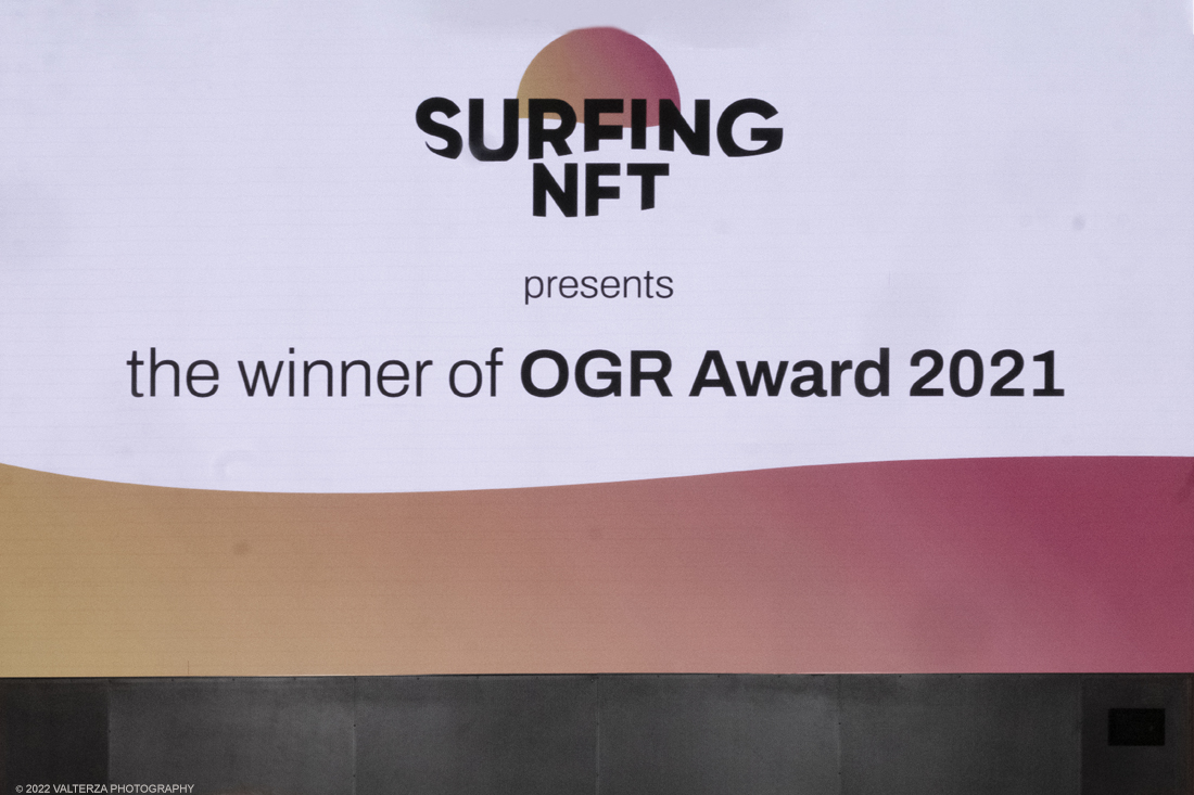 _DSF5673.jpg - 09/03/2022. Lâ€™OGR Award nasce come riconoscimento allâ€™artista che meglio restituisce il complesso e sofisticato rapporto tra arte, tecnologia e innovazione, dando particolare attenzione agli sviluppi digitali. Al suo quarto anno, il premio dialoga e accompagna Surfing NFT. Nella foto il manifesto dell'evento