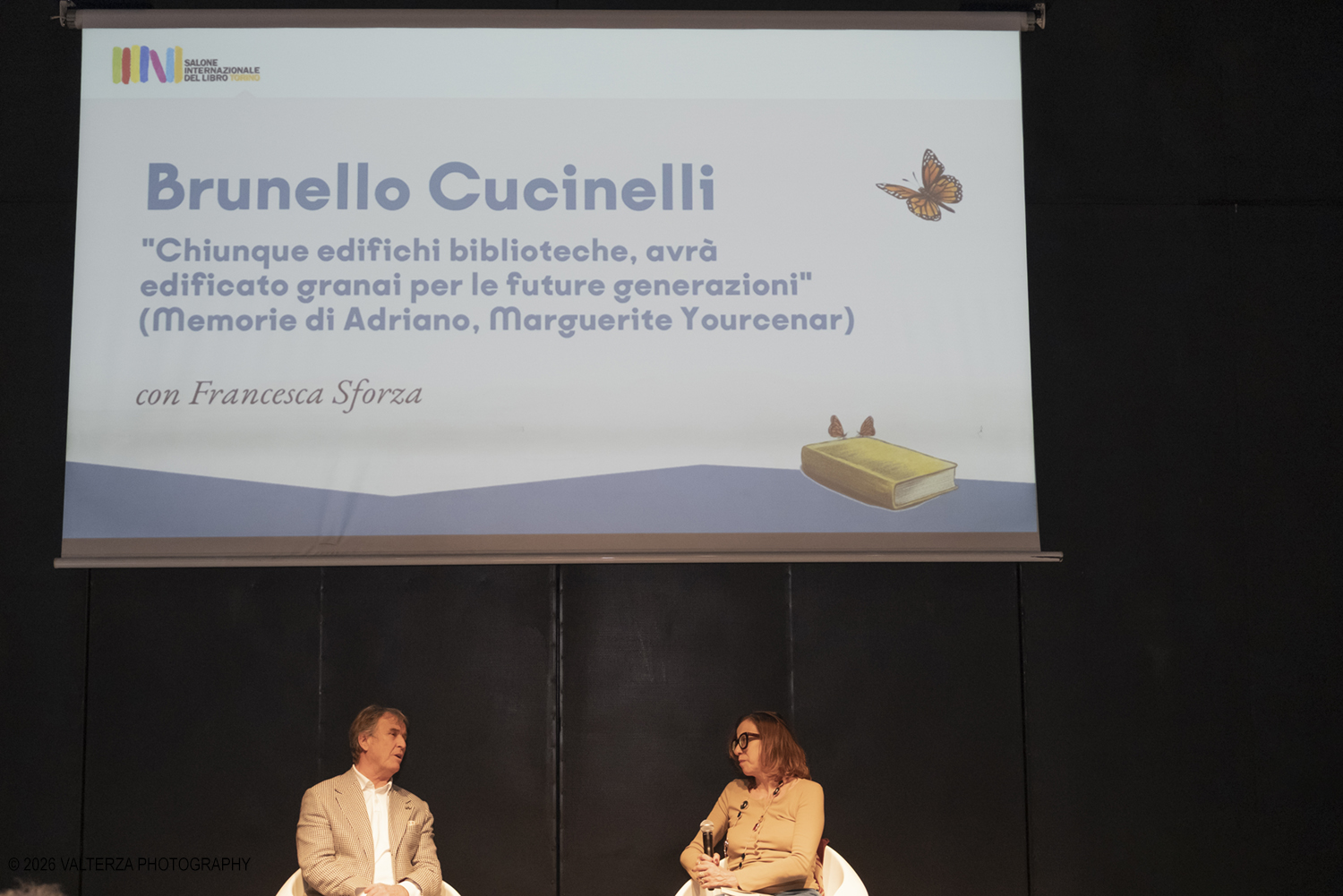 _DSF2243.jpg - 16/05/2026. Torino. Al Salone del Libro di Torino, Brunello Cucinelli ha esposto la sua filosofia lavorativa, il cosiddetto Capitalismo Umanistico, in cui vengono conciliati il profitto per lâ€™azienda e la dignitÃ  economica e morale per gli impiegati Nella foto Francesca Sforza in dialogo con Brunello Cicinelli
