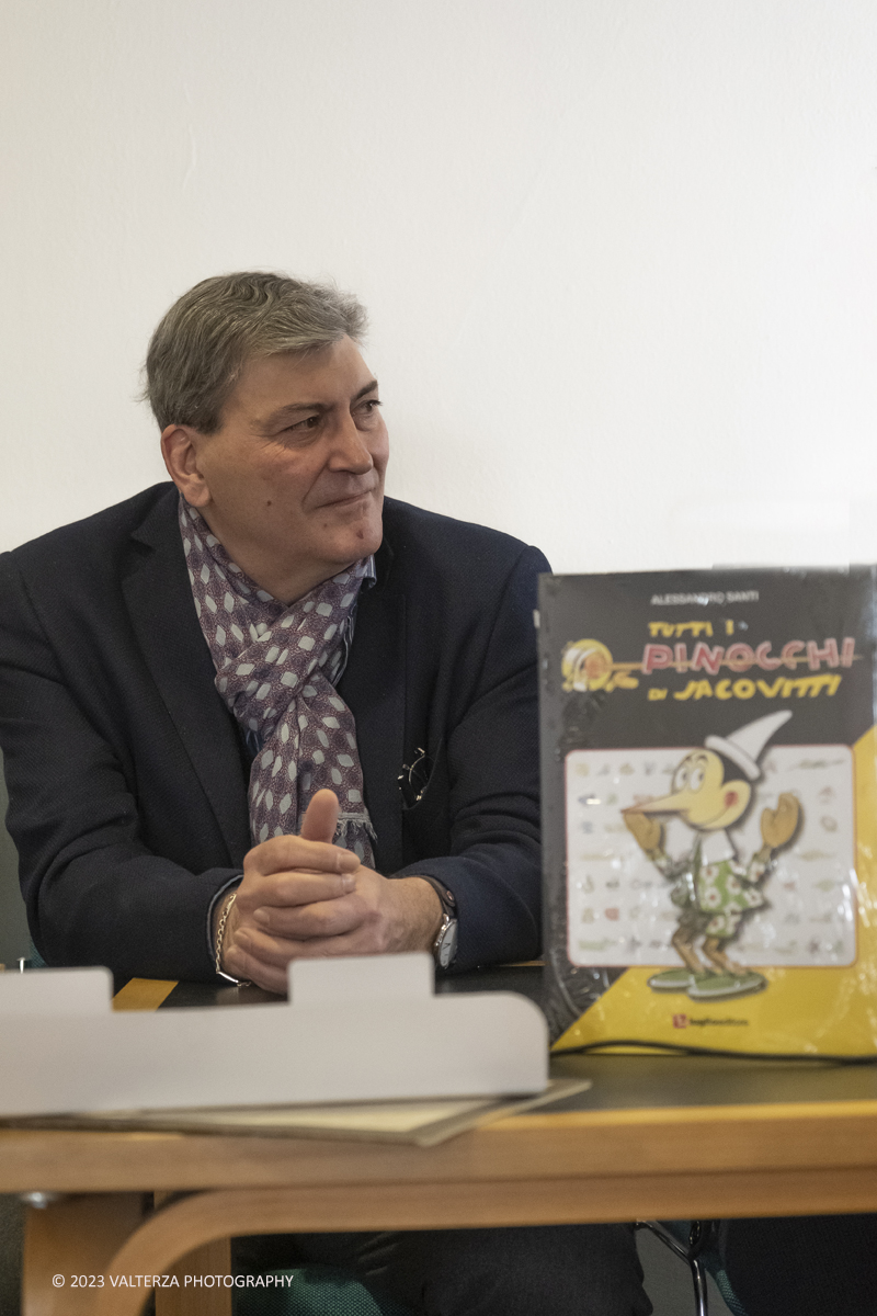 _DSF2297.jpg - 15/04/2023.Torino. Torino Comics celebra i 100 anni dalla nascita di Benito Jacovitti: 1923-2023 , uno degli autori italiani di fumetti piÃ¹ importanti del Novecento. Lâ€™autore Alessandro Santi, Dino Aloi  Marco Di Nicola e salvagno Luca hanno presentato il nuovo libro Tutti i Pinocchi di Jacovitti (Luglio ed.) allo stand di Poste Italiane Ã¨ stata  allestita una mostra dedicata a Jacovitti ed erano disponibili prodotti dedicati allâ€™artista, tra cui una litografia che ritrae il personaggio di Coccobill, un folder e un cofanetto con sei cartoline. Nella foto Dino Aloi